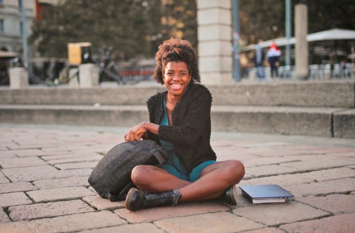 young smiling woman in the street